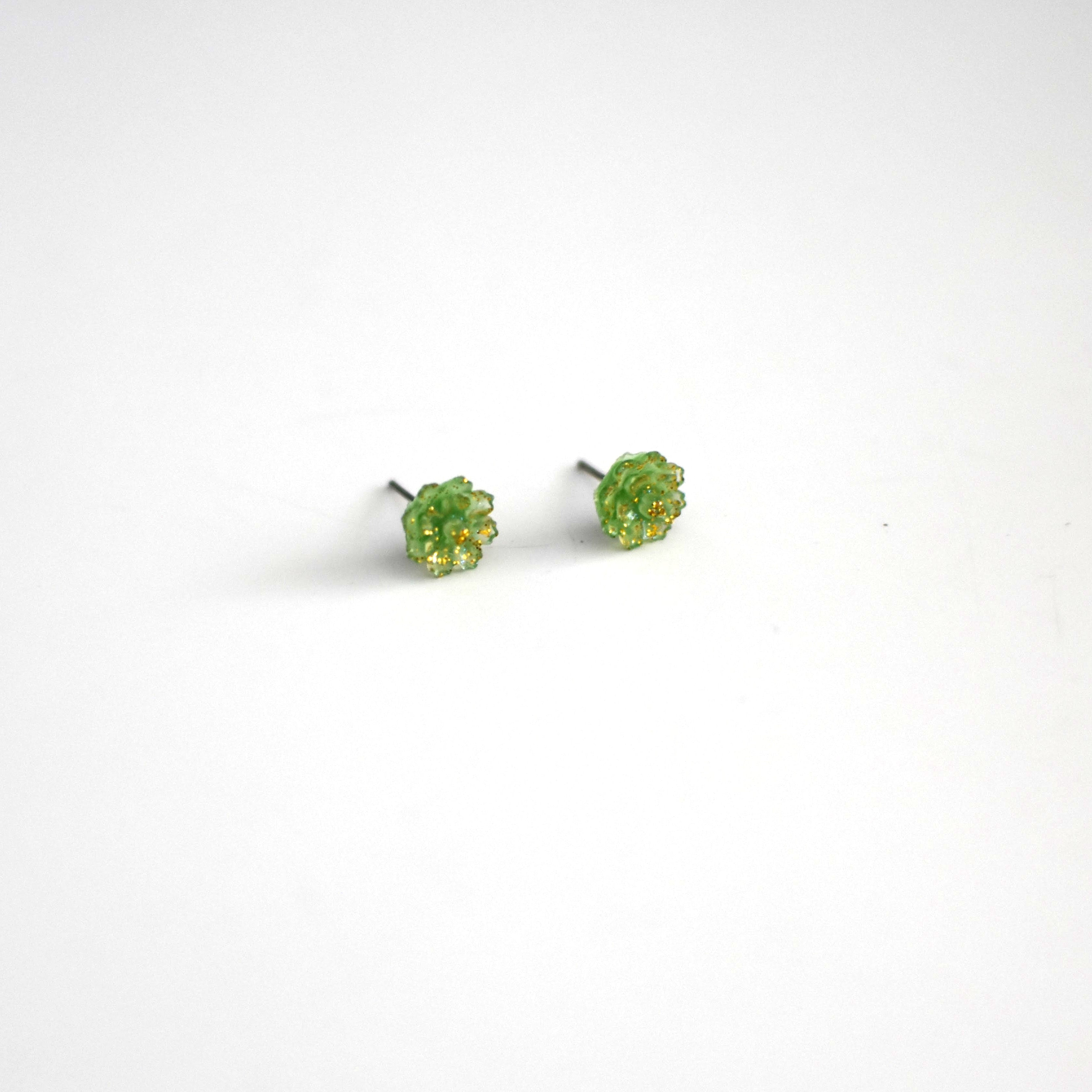 brai-glitz-Pair of green stud earrings on a white background